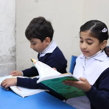 Students exploring worlds through the pages.